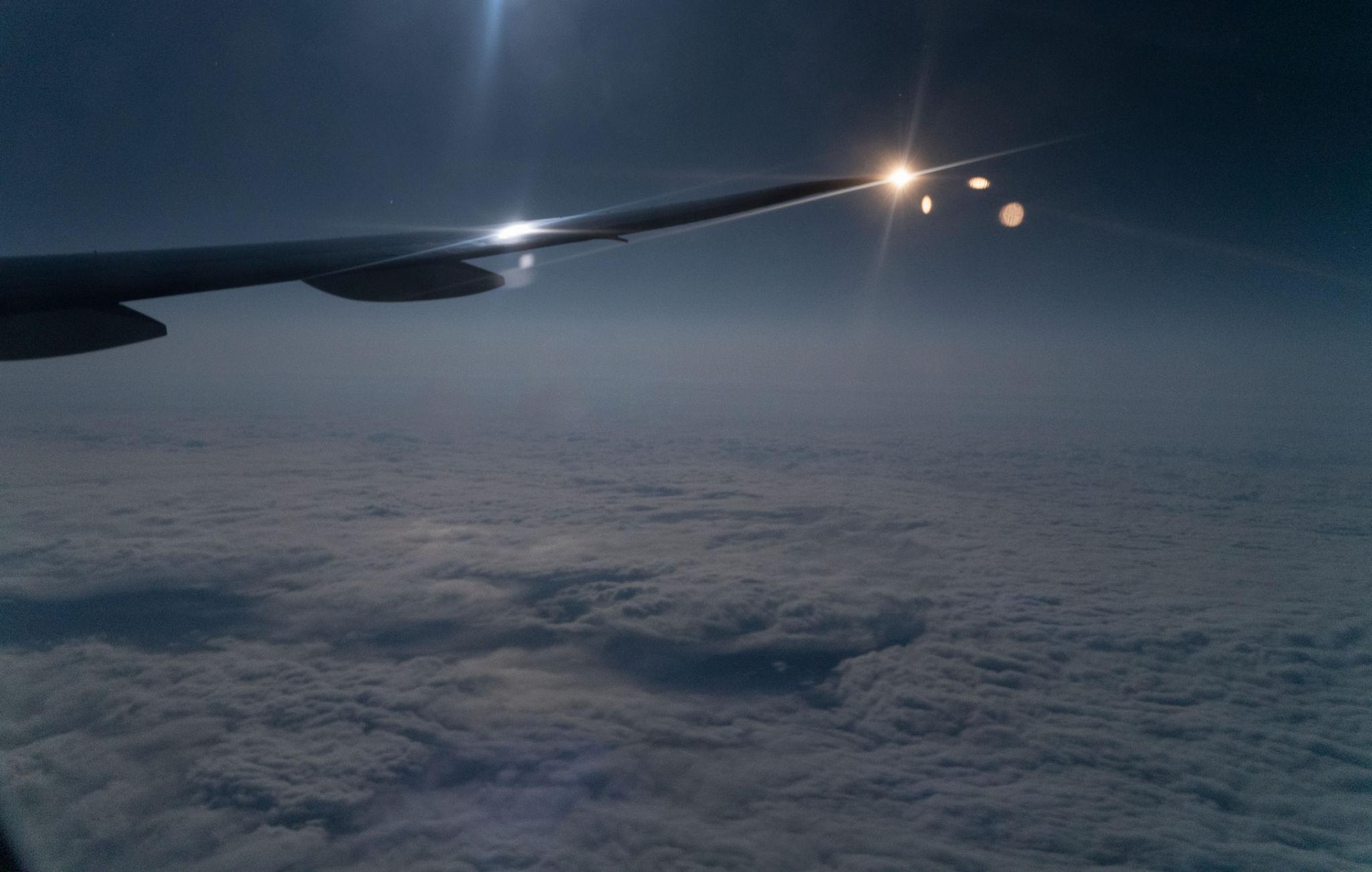 Night flight above the clouds